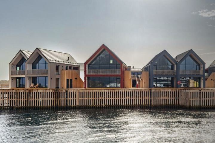 The row from the water, 7 apartment houses on the quay, Henningsvær · Norway